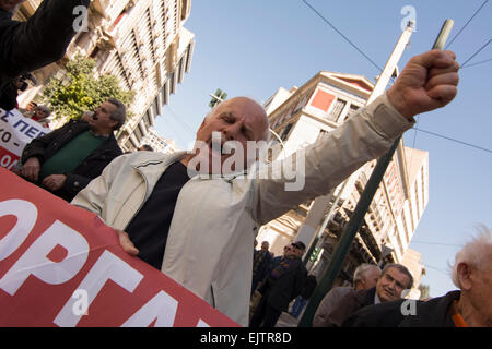 Athens, Greece, 01 April 2014. Pensioners hold banners and shout slogans. They staged a demonstration to demand decent pensions and healthcare. Credit:  Nikolas Georgiou/Alamy Live News Stock Photo
