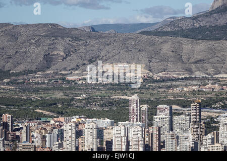 Benidorm aerial view from the cross looking over the new town, with a mass of  buildings and terra mitica in the background. Stock Photo