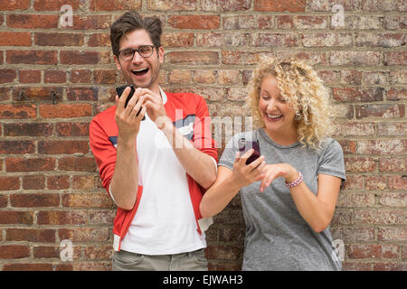 Couple using cell phones Stock Photo