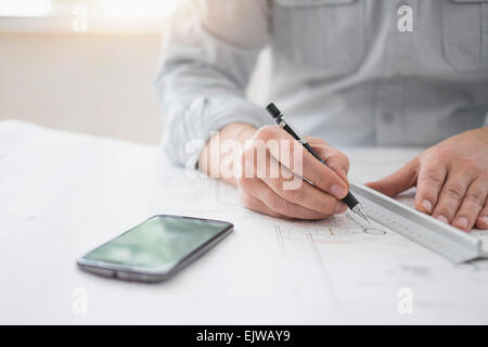 Architecture, hands and blueprint on table for drawing, sketch and ...