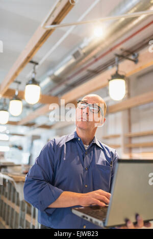 Business owner working with laptop Stock Photo