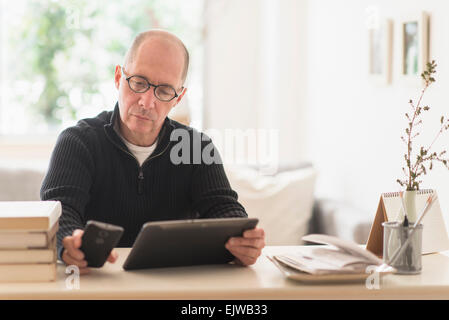 Mature man working in home office Stock Photo