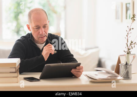 Mature man working in home office Stock Photo