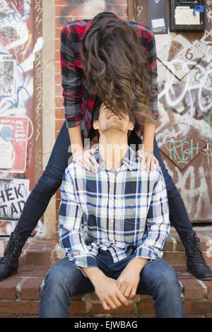 USA, New York State, New York City, Brooklyn, Young couple face to face on sidewalk Stock Photo