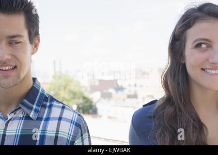 USA, New York State, New York City, Brooklyn, Young couple looking sideways Stock Photo