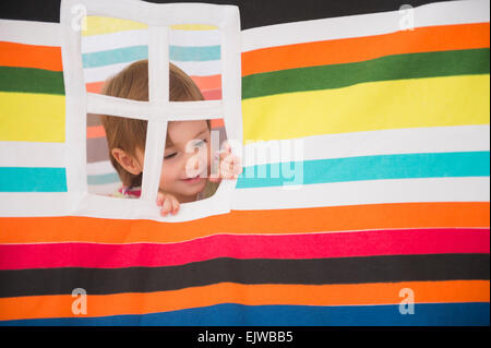 Girl (2-3) looking out window Stock Photo