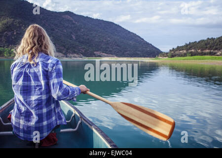 USA, Colorado, Harvey Gap, Woman canoeing in lake Stock Photo