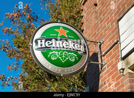 famous heineken logo at the facade of a bar. Heineken is one of the largest breweries in the world and employs over 80,000 peopl Stock Photo
