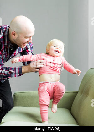 Father holding baby son (2-3) Stock Photo