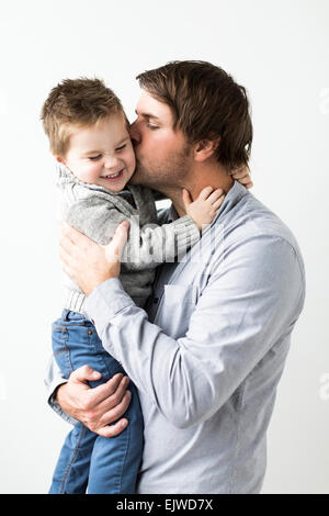 Father kissing son (2-3) Stock Photo