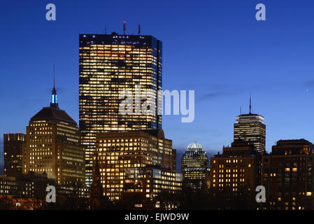 USA, Massachusetts, Boston, Copley Square, Illuminated office buildings at dusk Stock Photo