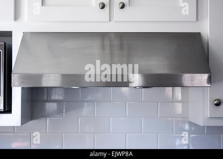 Modern aluminum kitchen range or stove hood Stock Photo