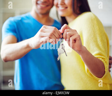 Young couple showing key from new house Stock Photo