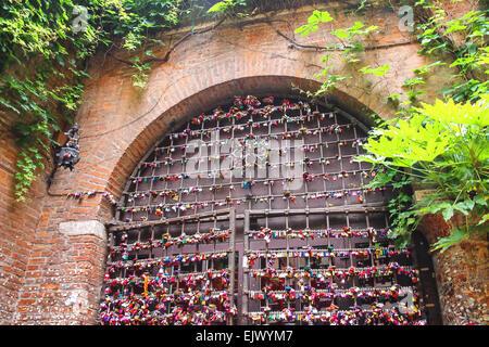 VERONA, ITALY - MAY 7, 2014: Many love locks on the gates of the Juliet house in Verona, Italy Stock Photo