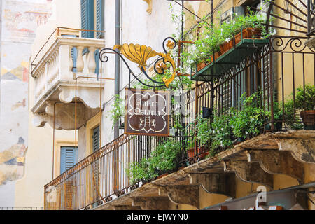 VERONA, ITALY - MAY 7, 2014: Signboard of the restaurant ' Antica Ostaria' in Verona, Italy Stock Photo