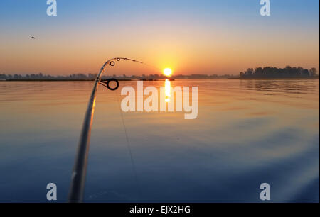 Down Rigging Rod Down rigging fishing rod at the sunrise on the river bank Stock Photo ...
