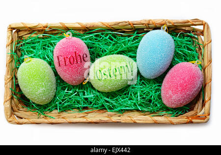 Colorful Easter eggs in an Easter basket Stock Photo
