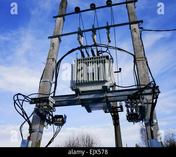Blue heavenly sky electric transformer on a column - energy for the winter village concept. Stock Photo