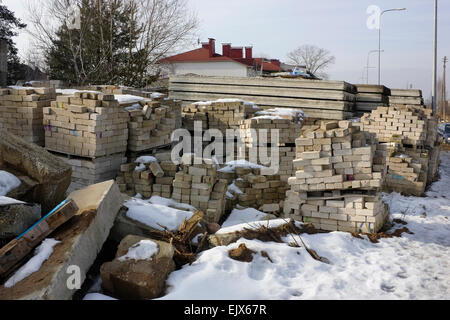 Thousand old white silicate bricks and concrete blocks on the thrown building village landscape Stock Photo