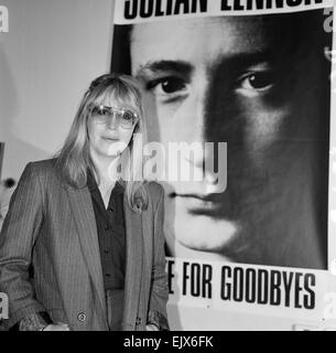 Cynthia Lennon, poses for photographs, 10th November 1984. Pictured standing next to poster of her son Julian Lennon, Too Late for Goodbyes, Single. Stock Photo