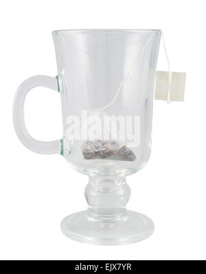 Glass teacup with a tea bag inside Stock Photo