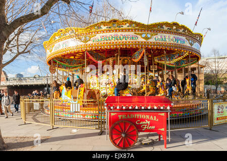 Traditional Galloping Horses Merry Go Round or roundabout, Southbank, London, England, UK Stock Photo