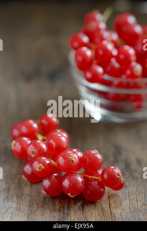 Red currants isolated on old wood Stock Photo