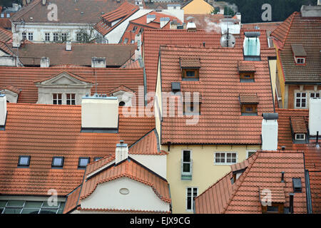 High angle view of many inclined roofs of pantiles in Mala Strana (Little Quarter) in Prague from view point at Prague Castle. Stock Photo