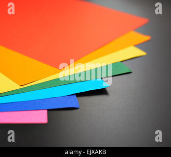 Colorful sheets over the black surface Stock Photo