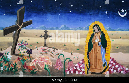 This exotic mural in the South Central district of Albuquerque, New Mexico, with its Salvador Dali like  curving cross. Stock Photo