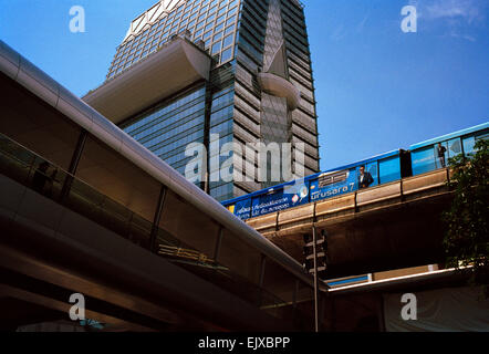 BTS train amongst the modern skyscrapers of Sukhumvit in Bangkok in Thailand in Far East Southeast Asia. Skyscraper Tower Urban City Cities Travel Stock Photo