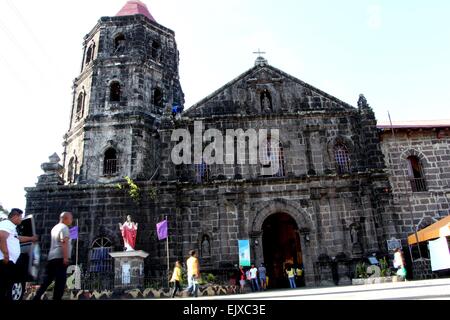 Manila, Philippines. 30th Mar, 2015. The workers while restoring the top front of San Ildefonso De Toledo Parish Church in Tanay, Rizal. The church of San Ildefonso De Toledo Parish Church in Tanay, Rizal (East province of Manila) made a historical landmark and first in the Philippines that make a millennium tree of Acacia to become an icon or Saint. © Gregorio B. Dantes Jr./Pacific Press/Alamy Live News Stock Photo