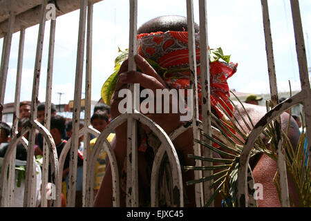 San Fernando, Philippines. 02nd Apr, 2015. A penitent praying in front of the San Fernando Cathedral in Pampanga, during the observance of Holy Thursday. Credit:  J Gerard Seguia/Pacific Press/Alamy Live News Stock Photo