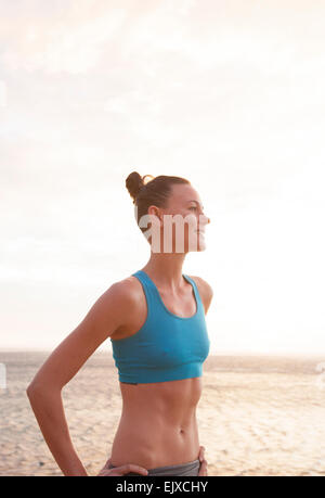 Woman on Beach in Blue Sport Bra