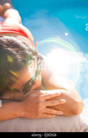Woman Lying on Swimming Pool Edge