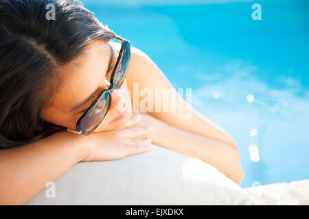 Woman Lying on Swimming Pool Edge