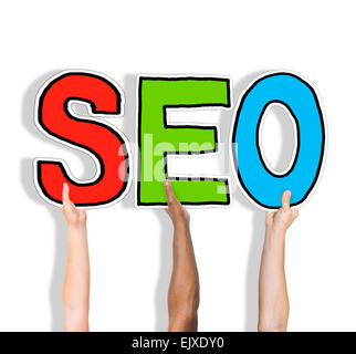 Multiethnic Group of Hands Holding Letter SEO Stock Photo