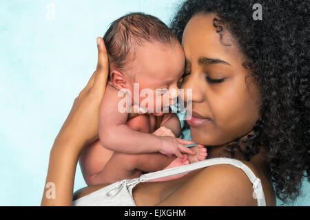Loving african mother holding her 11 days old newborn baby Stock Photo