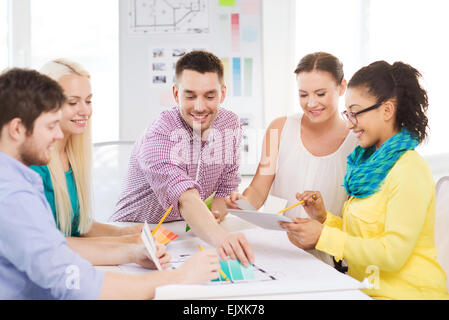 smiling interior designers working in office Stock Photo