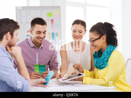 smiling interior designers working in office Stock Photo