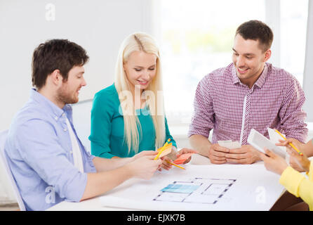 smiling interior designers working in office Stock Photo