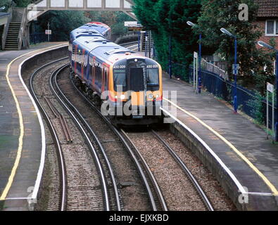 AJAXNETPHOTO - 2006. WOOLSTON,ENGLAND - THE TRAIN WAITING AT PLATFORM.... IS SUBURBAN  COMMUTER. PHOTO:JONATHAN EASTLAND/AJAX REF:300029 Stock Photo