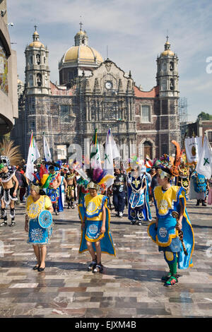 Colorfully dressed pilgrims and dancers are everywhere during the celebration of the Virgin of Guadalupe Feast Day Stock Photo