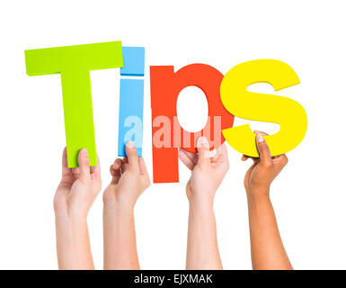 Multi-Ethnic Group Of People's Arms Raised Holding Letters That Form Tips Stock Photo