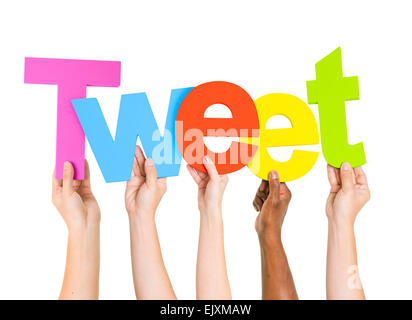 Multi-Ethnic Group Of People Holding The Word Tweet Stock Photo