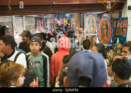 Pilgrims crowd the streets and mercado on their way to the Basilica de Guadalupe at La Villa in Mexico City. Stock Photo