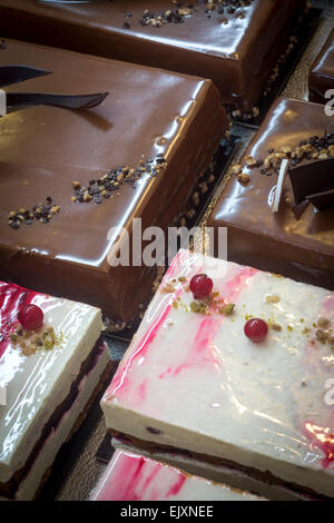The display of pastries in cake shop window (France). Desserts exposés dans la vitrine d'une pâtisserie (France). Stock Photo