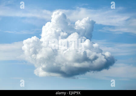 Unusual shaped cloud against the blue sky. Stock Photo