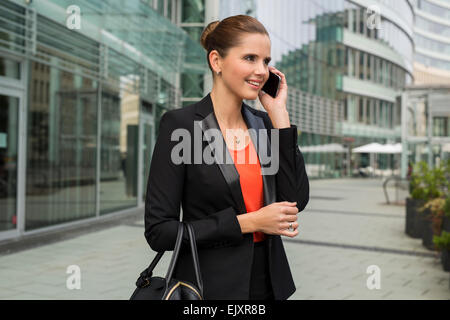 Young businesswoman with cellphone Stock Photo