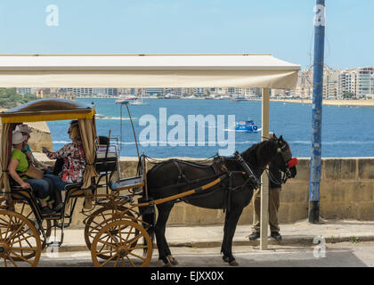 Horse drawn taxi cab in Valletta, Malta. Stock Photo